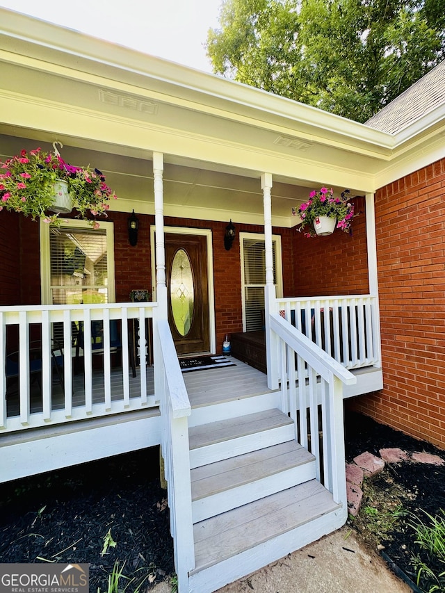 4100 Jewel Rdg, Monroe, GA 30655 - view of exterior entry with brick siding and a porch
