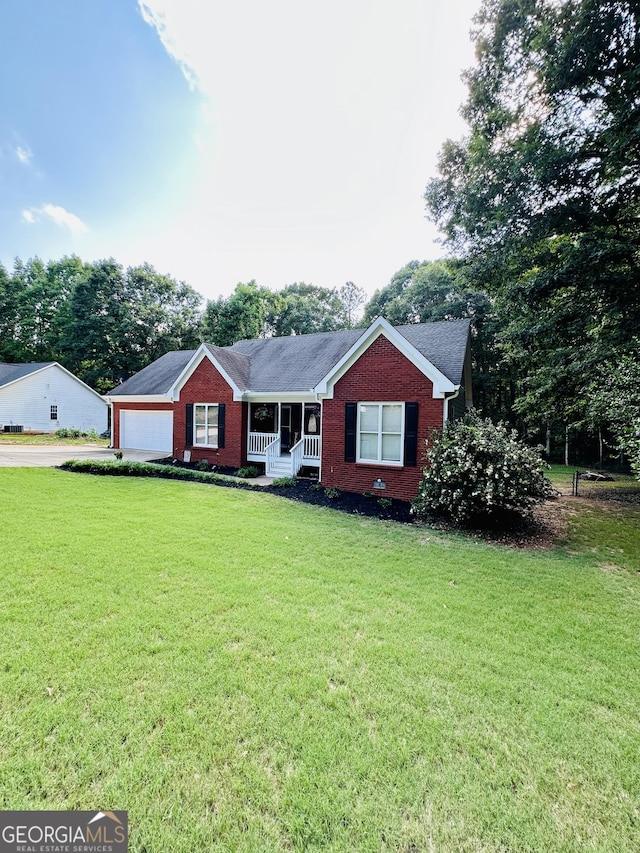 4100 Jewel Rdg, Monroe, GA 30655 - ranch-style home with brick siding, a front yard, driveway, and a garage
