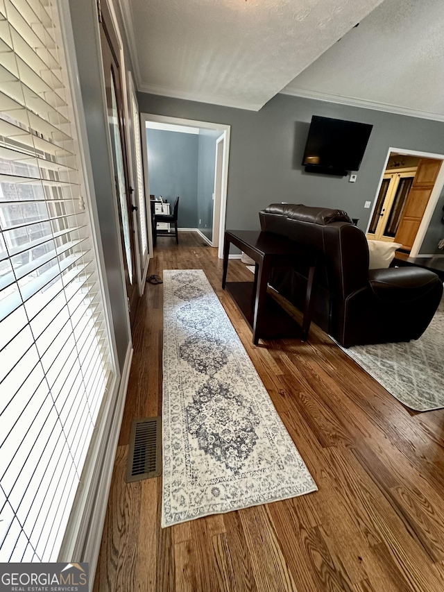 4100 Jewel Rdg, Monroe, GA 30655 - living room with dark wood-style flooring, ornamental molding, and baseboards