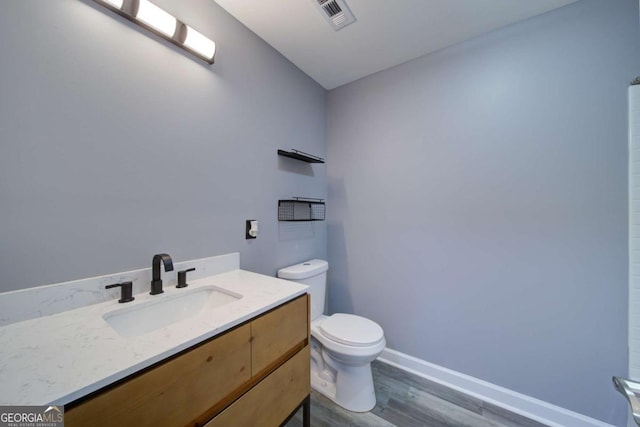 830 Buffington Way, Canton, GA 30115 - bathroom featuring wood finished floors, vanity, baseboards, toilet, and visible vents