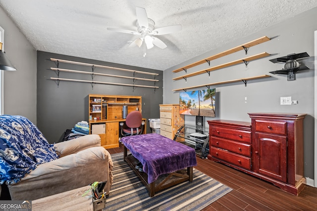 interior space with a textured ceiling and dark wood finished floors