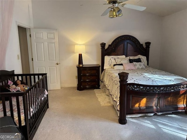 bedroom with baseboards, carpet flooring, and ceiling fan