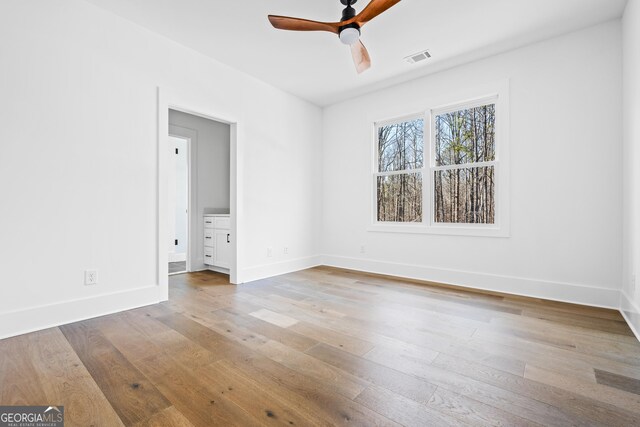 18390 Birmingham Hwy, Alpharetta, GA 30004 - spare room featuring wood-type flooring, visible vents, baseboards, and ceiling fan