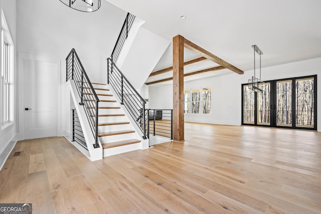 18390 Birmingham Hwy, Alpharetta, GA 30004 - interior space with stairs, an inviting chandelier, beamed ceiling, visible vents, and wood finished floors