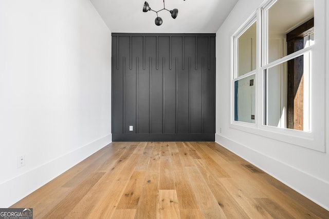18390 Birmingham Hwy, Alpharetta, GA 30004 - unfurnished room with baseboards, visible vents, a chandelier, and wood-type flooring