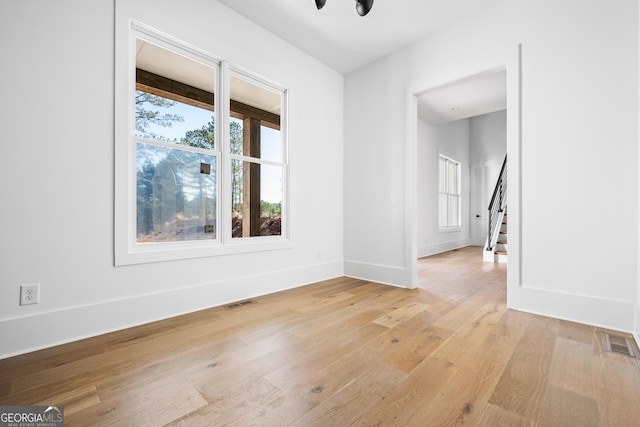 18390 Birmingham Hwy, Alpharetta, GA 30004 - empty room featuring light wood-style floors, baseboards, a healthy amount of sunlight, and visible vents