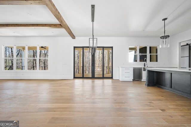 18390 Birmingham Hwy, Alpharetta, GA 30004 - interior space with light countertops, beam ceiling, pendant lighting, light wood finished floors, and stainless steel dishwasher