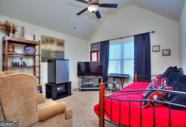 carpeted bedroom with a ceiling fan, vaulted ceiling, and visible vents