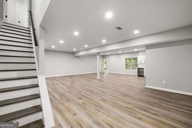 1590 Highland Farm Dr, Suwanee, GA 30024 - below grade area featuring recessed lighting, light wood-type flooring, stairway, and baseboards