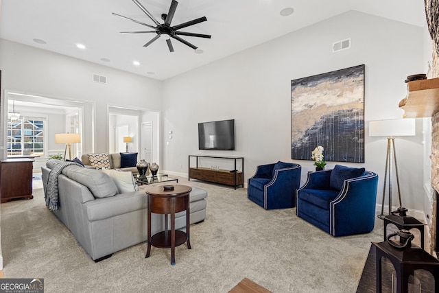 2105 Rotunda Ct, Conyers, GA 30094 - living room with carpet flooring, vaulted ceiling, ceiling fan, and visible vents