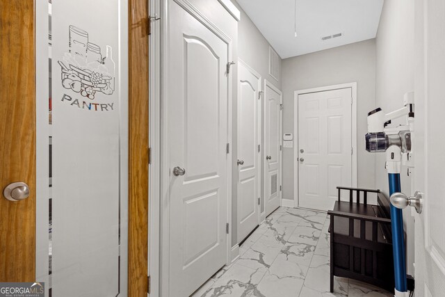 2105 Rotunda Ct, Conyers, GA 30094 - hall with marble finish floor and visible vents