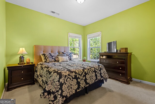 2105 Rotunda Ct, Conyers, GA 30094 - carpeted bedroom with baseboards and visible vents