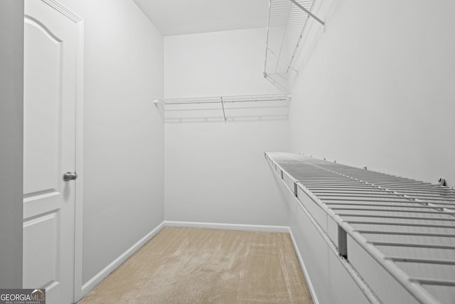 2105 Rotunda Ct, Conyers, GA 30094 - walk in closet featuring light carpet