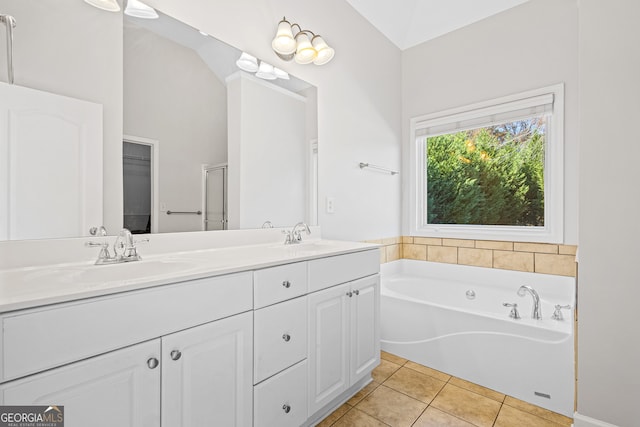 2105 Rotunda Ct, Conyers, GA 30094 - bathroom featuring tile patterned floors, a sink, a stall shower, double vanity, and a bath