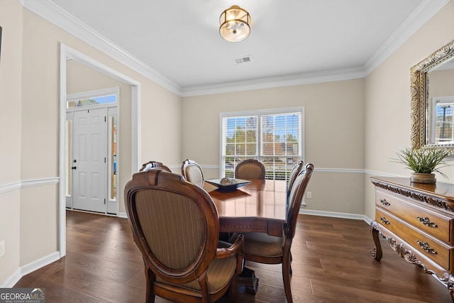 dining space with crown molding, visible vents, and plenty of natural light