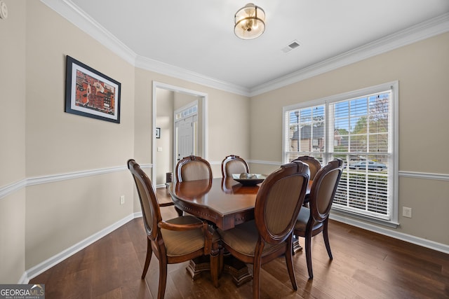 1803 Gold Finch Way, Lawrenceville, GA 30043 - dining space with ornamental molding, dark wood finished floors, and baseboards