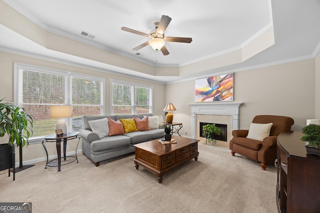 1803 Gold Finch Way, Lawrenceville, GA 30043 - living room with a ceiling fan, light colored carpet, crown molding, a raised ceiling, and a fireplace