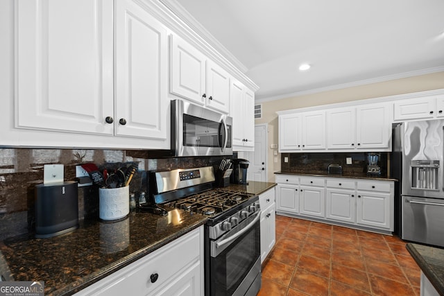 1803 Gold Finch Way, Lawrenceville, GA 30043 - kitchen featuring appliances with stainless steel finishes, ornamental molding, decorative backsplash, white cabinets, and dark stone counters