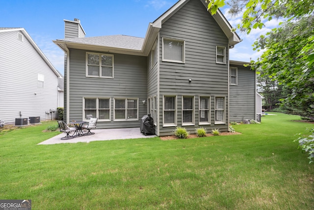 1803 Gold Finch Way, Lawrenceville, GA 30043 - back of house with a patio, a lawn, and a chimney