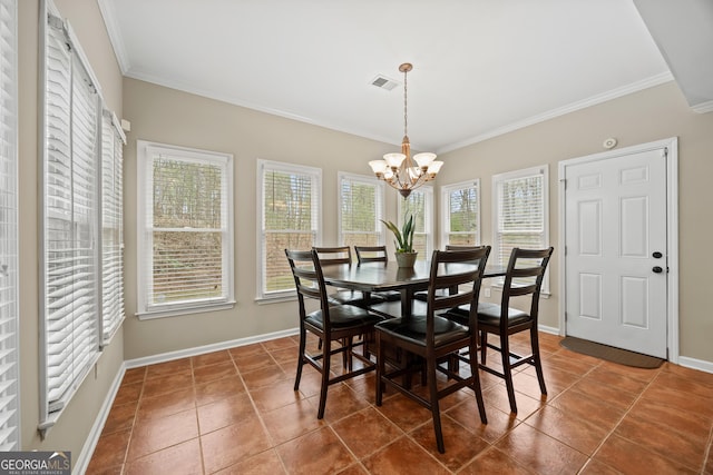 1803 Gold Finch Way, Lawrenceville, GA 30043 - dining area featuring crown molding, a chandelier, tile patterned floors, and baseboards