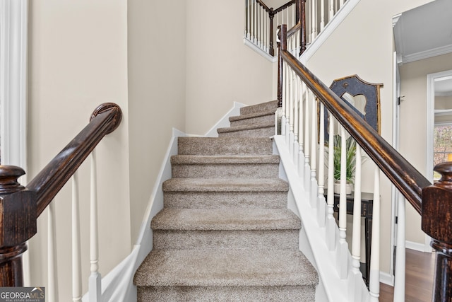 1803 Gold Finch Way, Lawrenceville, GA 30043 - staircase featuring ornamental molding, wood finished floors, and baseboards