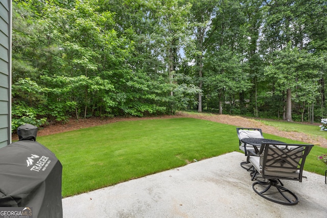 1803 Gold Finch Way, Lawrenceville, GA 30043 - view of green lawn with a patio area