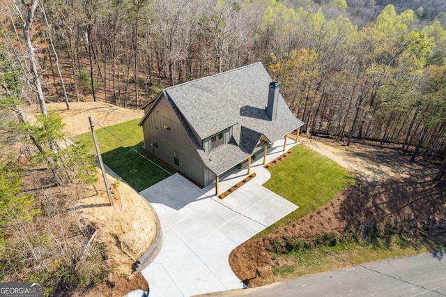 drone / aerial view with a view of trees