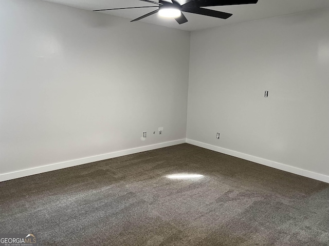 unfurnished room with baseboards, ceiling fan, and dark colored carpet