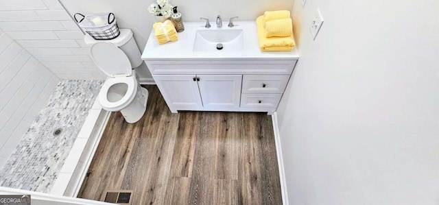 bathroom with toilet and vanity