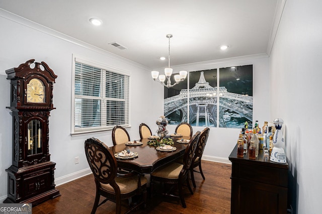 dining space featuring crown molding, baseboards, dark wood-style floors, and an inviting chandelier