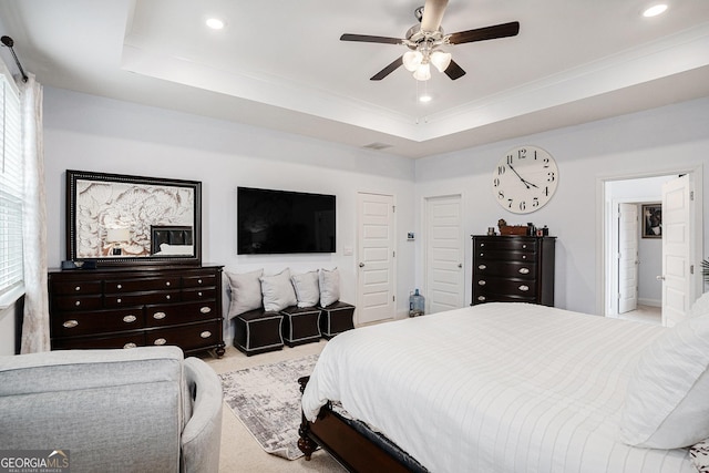carpeted bedroom with visible vents, recessed lighting, crown molding, and a tray ceiling