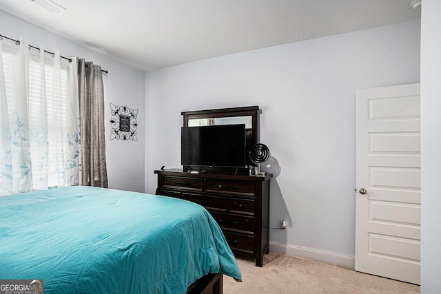 bedroom with light colored carpet, baseboards, and visible vents