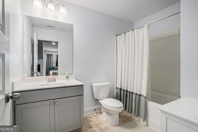 ensuite bathroom featuring vanity, toilet, baseboards, ensuite bathroom, and visible vents