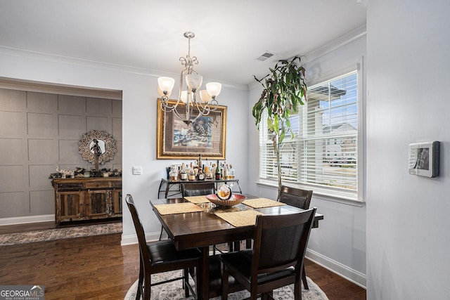 dining area featuring baseboards, ornamental molding, dark wood-style flooring, and a notable chandelier