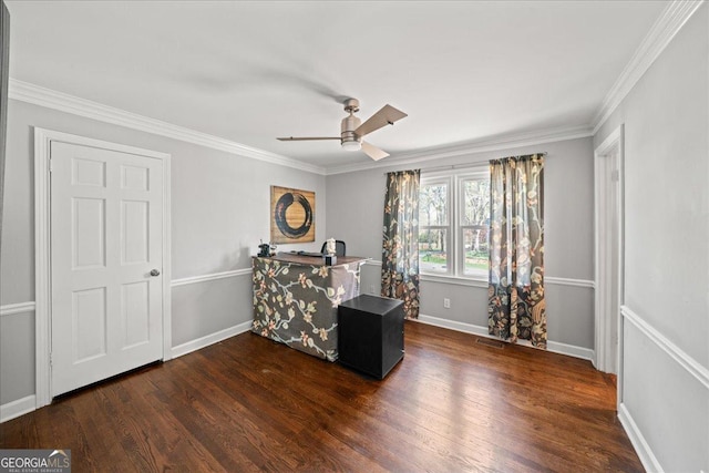 bedroom featuring dark wood finished floors, crown molding, ceiling fan, and baseboards
