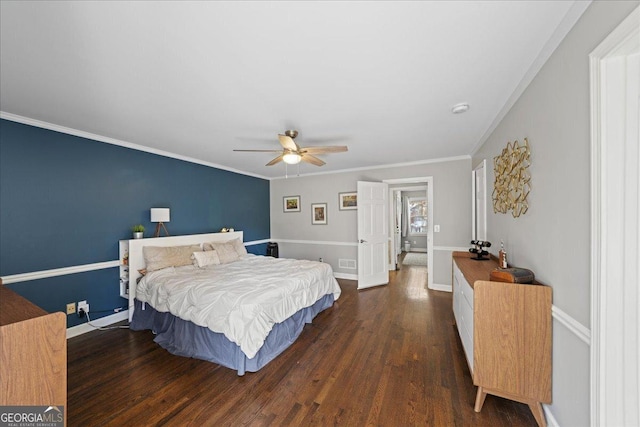 bedroom featuring wood finished floors, crown molding, baseboards, and a ceiling fan