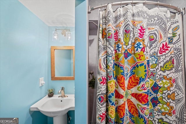 bathroom with a sink and a shower with curtain