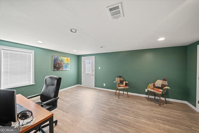 office space with wood finished floors, recessed lighting, and baseboards