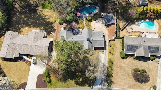 view of property location with a pool area