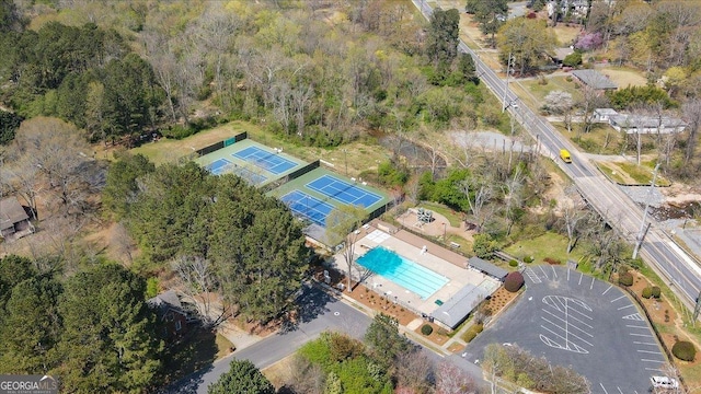 aerial view of property's location featuring a pool area