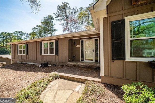 doorway to property with board and batten siding