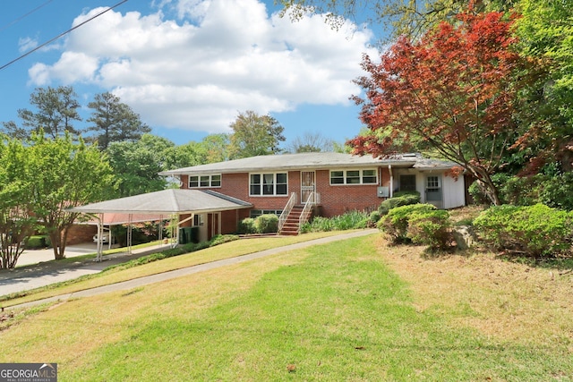 ranch-style house with a front yard and brick siding