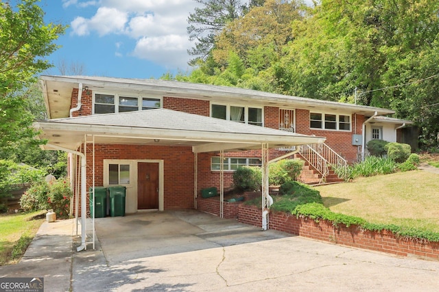 view of front of home with a front yard and brick siding
