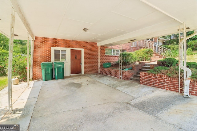 view of patio featuring a carport and stairway
