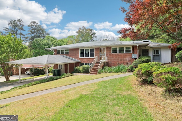 single story home featuring a carport, a front lawn, and brick siding