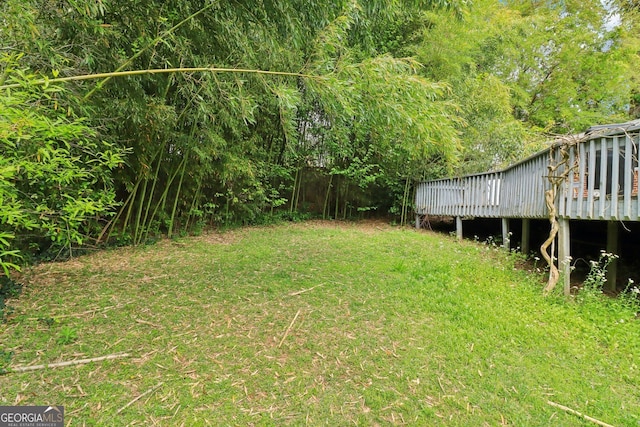view of yard with a deck