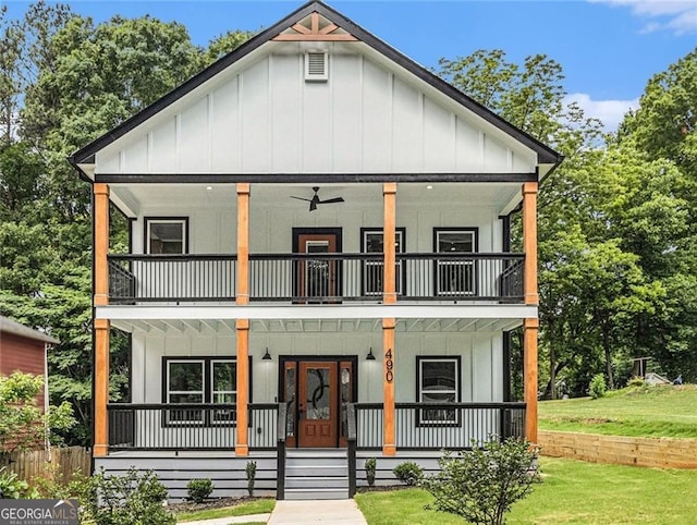490 Third Ave, Scottdale, GA 30079 - view of front of home featuring a balcony, board and batten siding, a porch, and a front yard