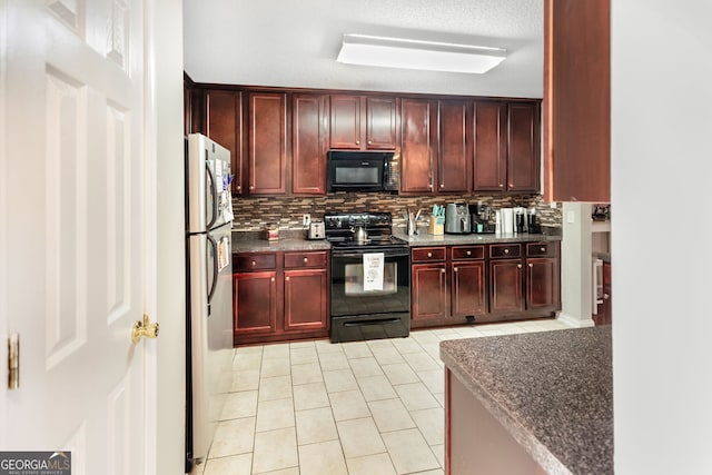 kitchen featuring backsplash, black appliances, dark brown cabinets, and light tile patterned flooring