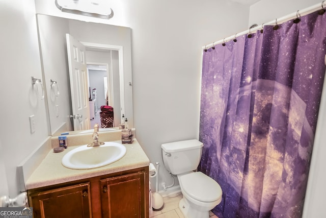 bathroom with tile patterned floors, a shower with shower curtain, vanity, and toilet