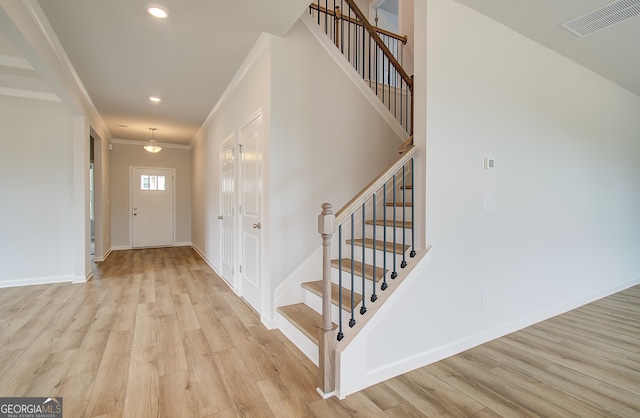 255 Arnewood Cir, Mcdonough, GA 30253 - stairs with wood finished floors, crown molding, recessed lighting, and baseboards